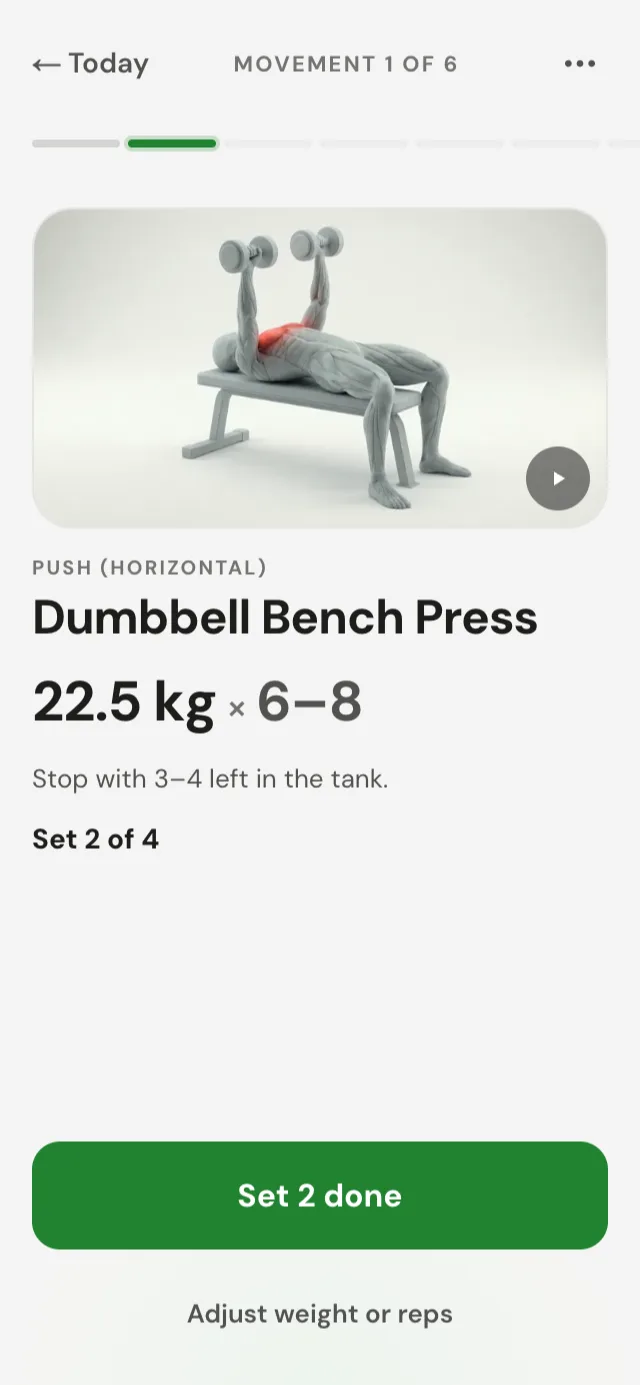 The guided session view, showing a movement demo, working weight and rep range.